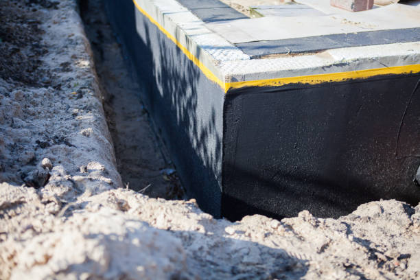 Professional Waterproofing technician working in Hebron, IL